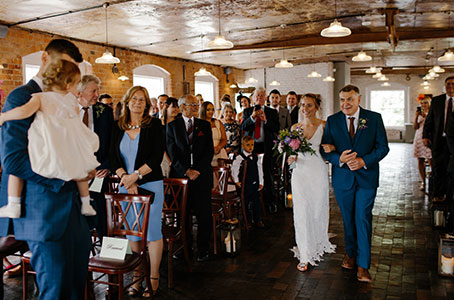 wedding planning bride walks down the aisle to fiance
