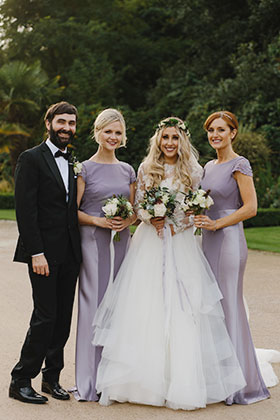 bride poses with her wedding party