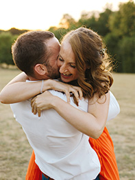 bride to be hugs groom after proposal