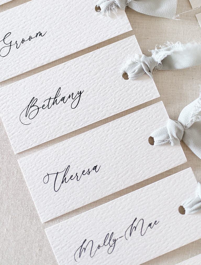 wedding table place cards in a row