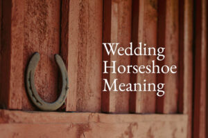 wedding horseshoe hangs on fence