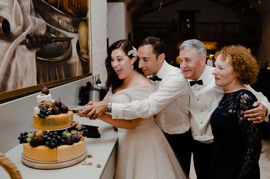 couple cut wedding cake