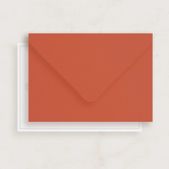 vibrant orange envelope against beige background
